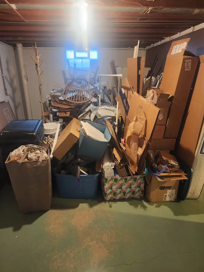 Roll-off dumpster container at job site for 20 Yard Dumpster Rental in Broadway